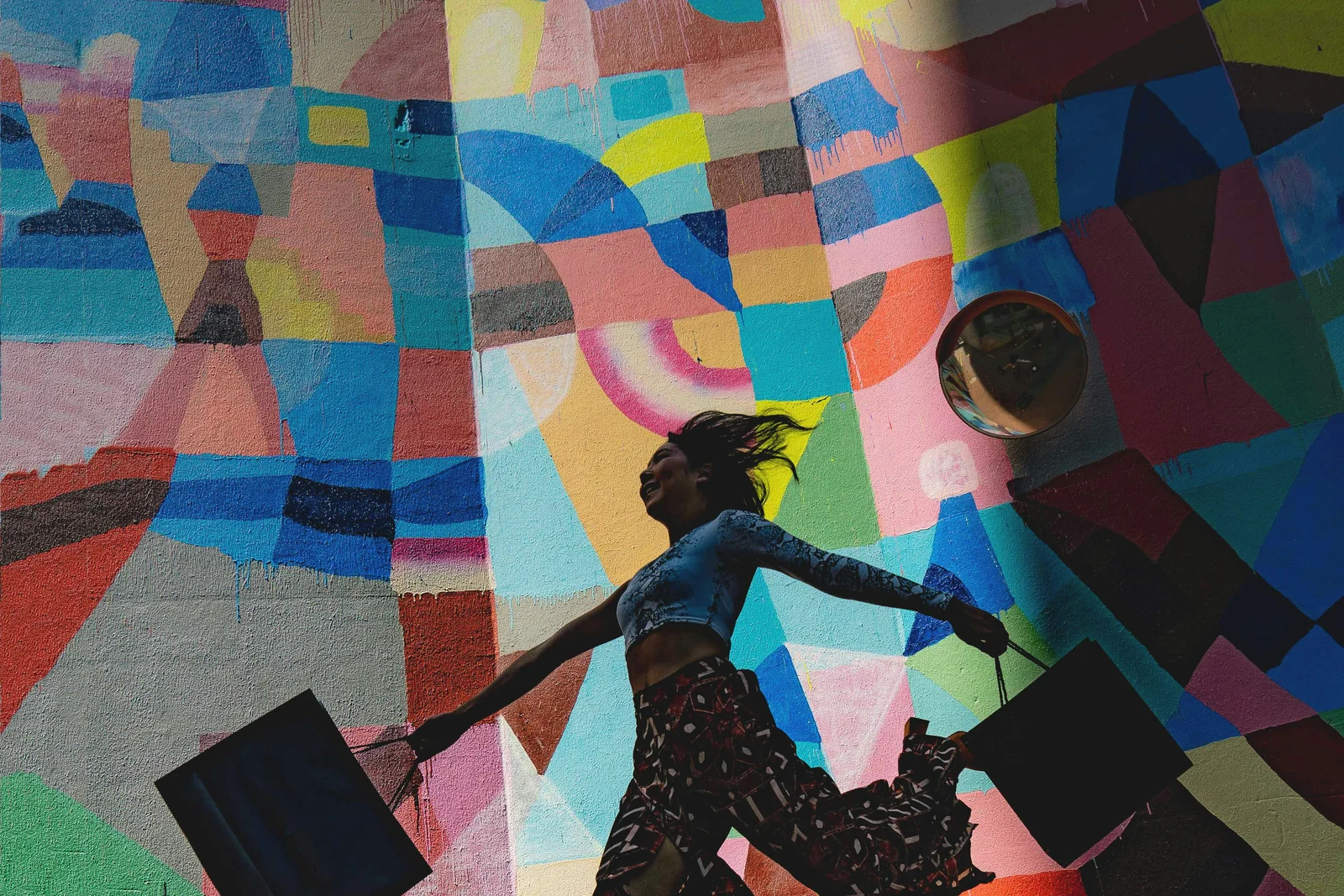 A shopper mid-stride with bags, the acquisition in customer acquisition cost