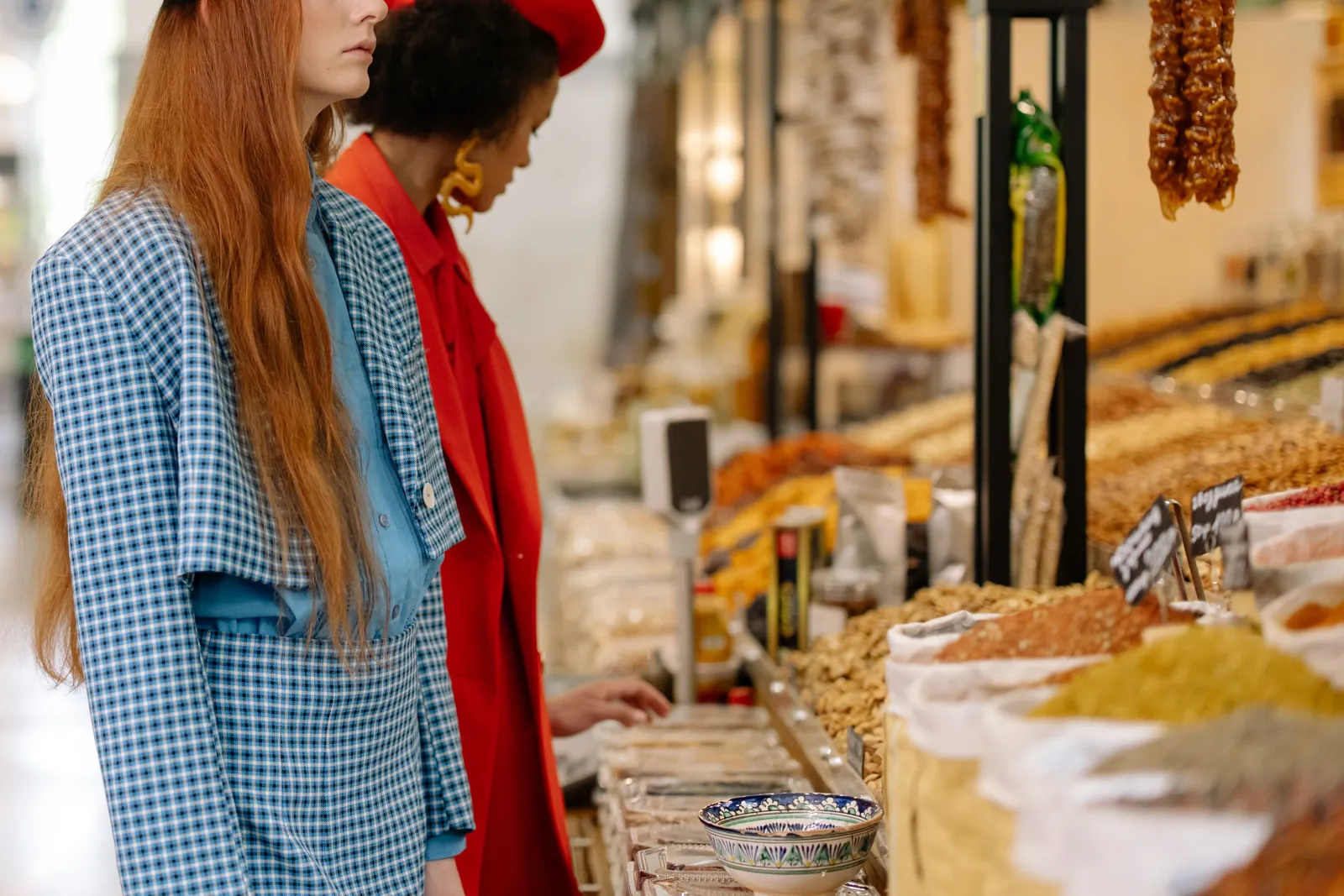 Shoppers browsing a gourmet market counter, representing Dean & DeLuca's content-driven social campaign