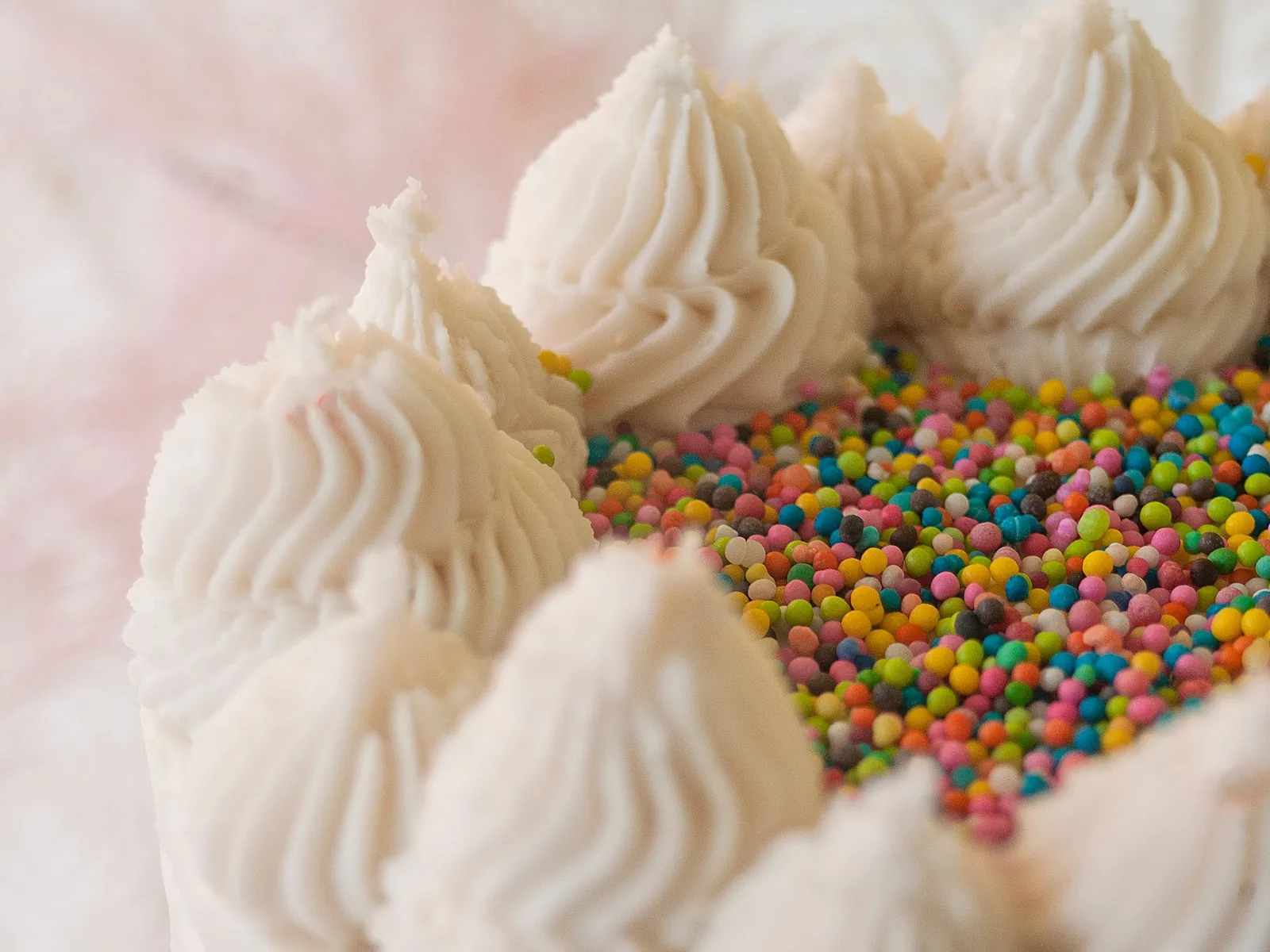 A frosted cake with rainbow sprinkles, representing the Duncan Hines and Birds Eye Facebook campaign