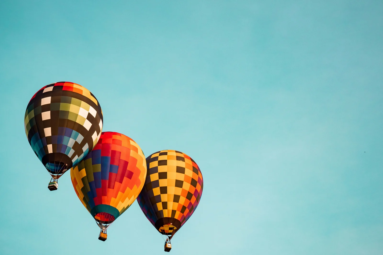 Three hot air balloons rising together like CPM, CPC, and CPA