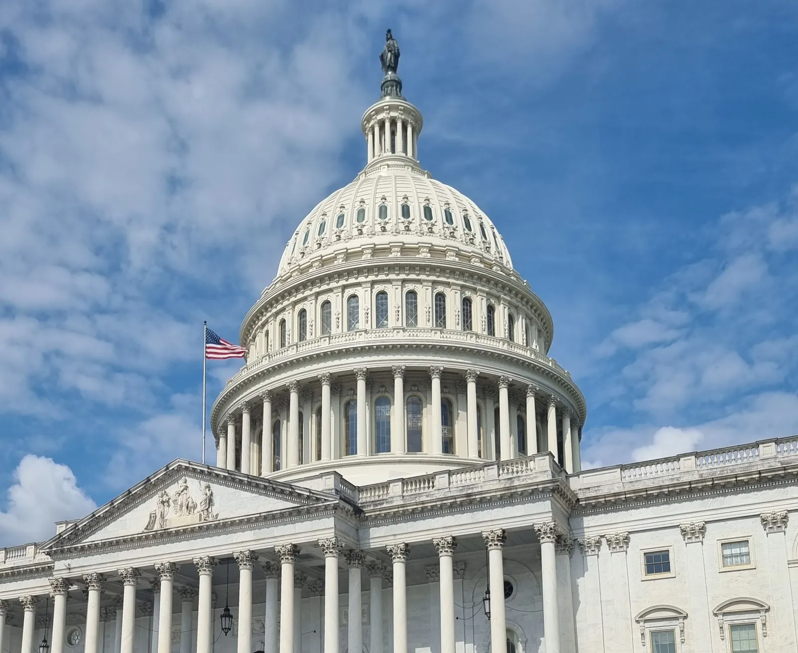 The United States Capitol dome against a blue sky, representing advocacy and public affairs advertising in Washington