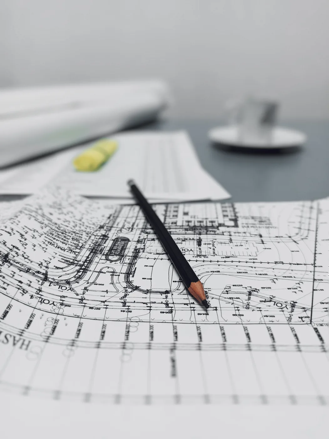 Blueprint and pencil representing a media plan