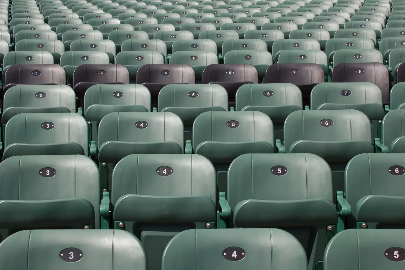 Empty stadium seating rows representing organic reach without paid amplification